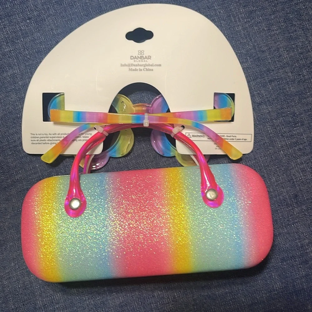 Sunglasses and case. Little girl. Few scratches on the frame. See pictures